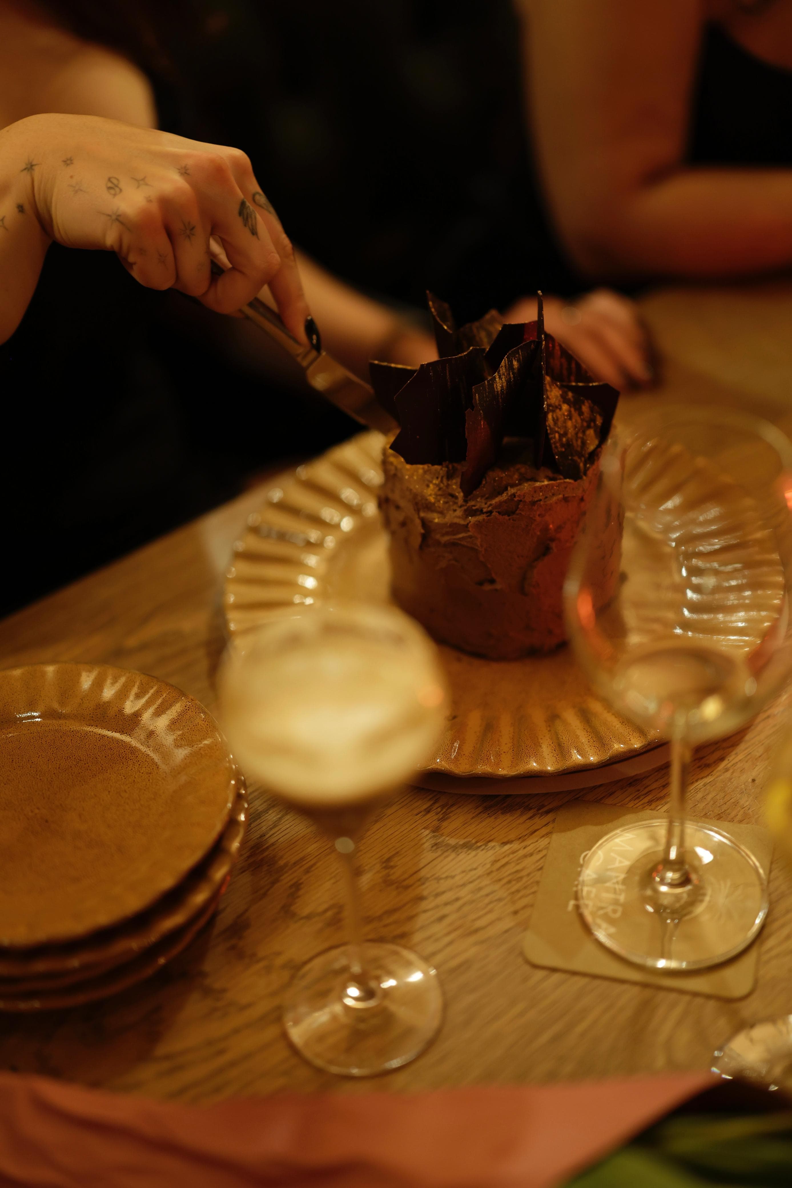 The first slice — cutting into the chocolate shard cake