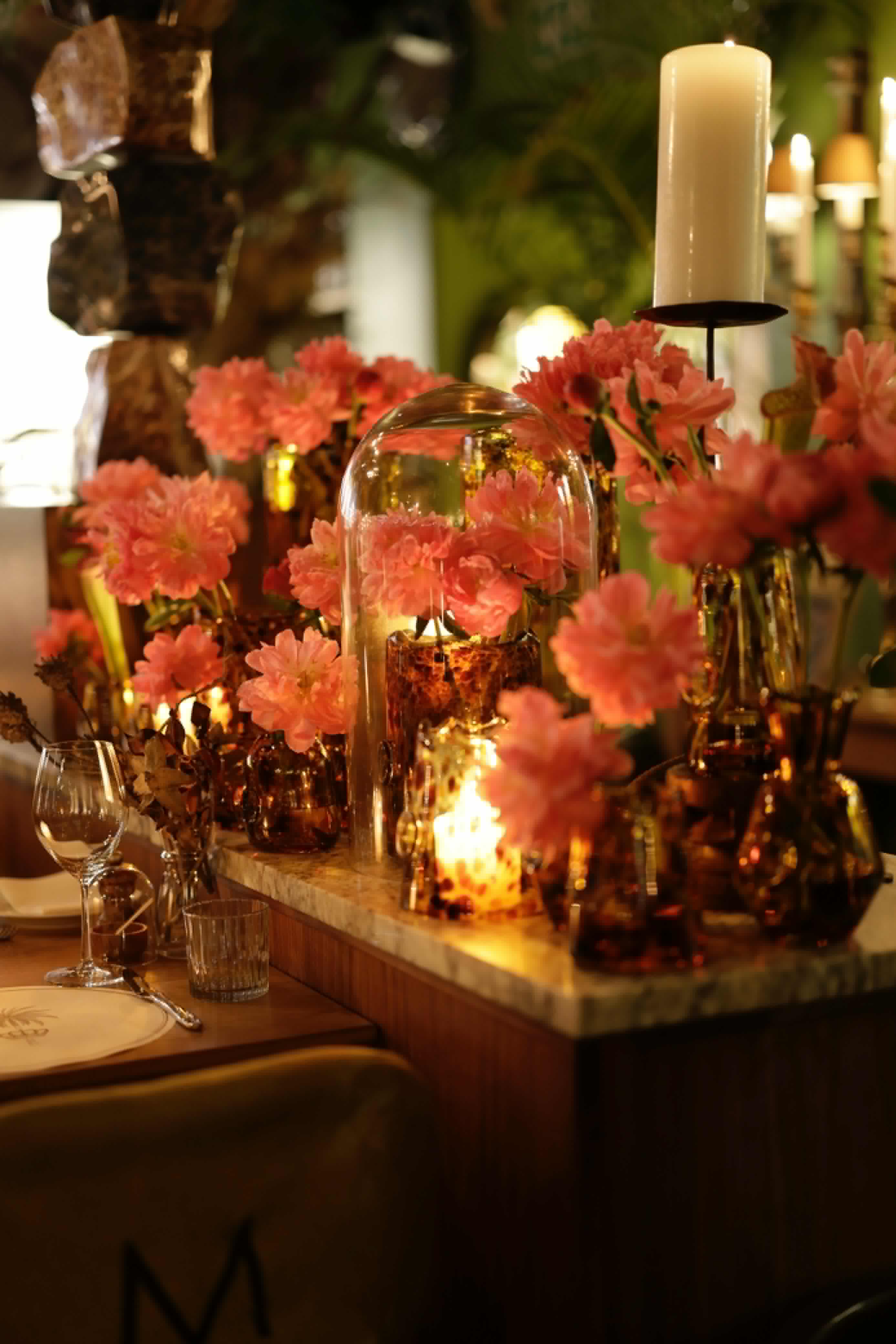Dahlias, amber glass and candlelight on a Mantra birthday table