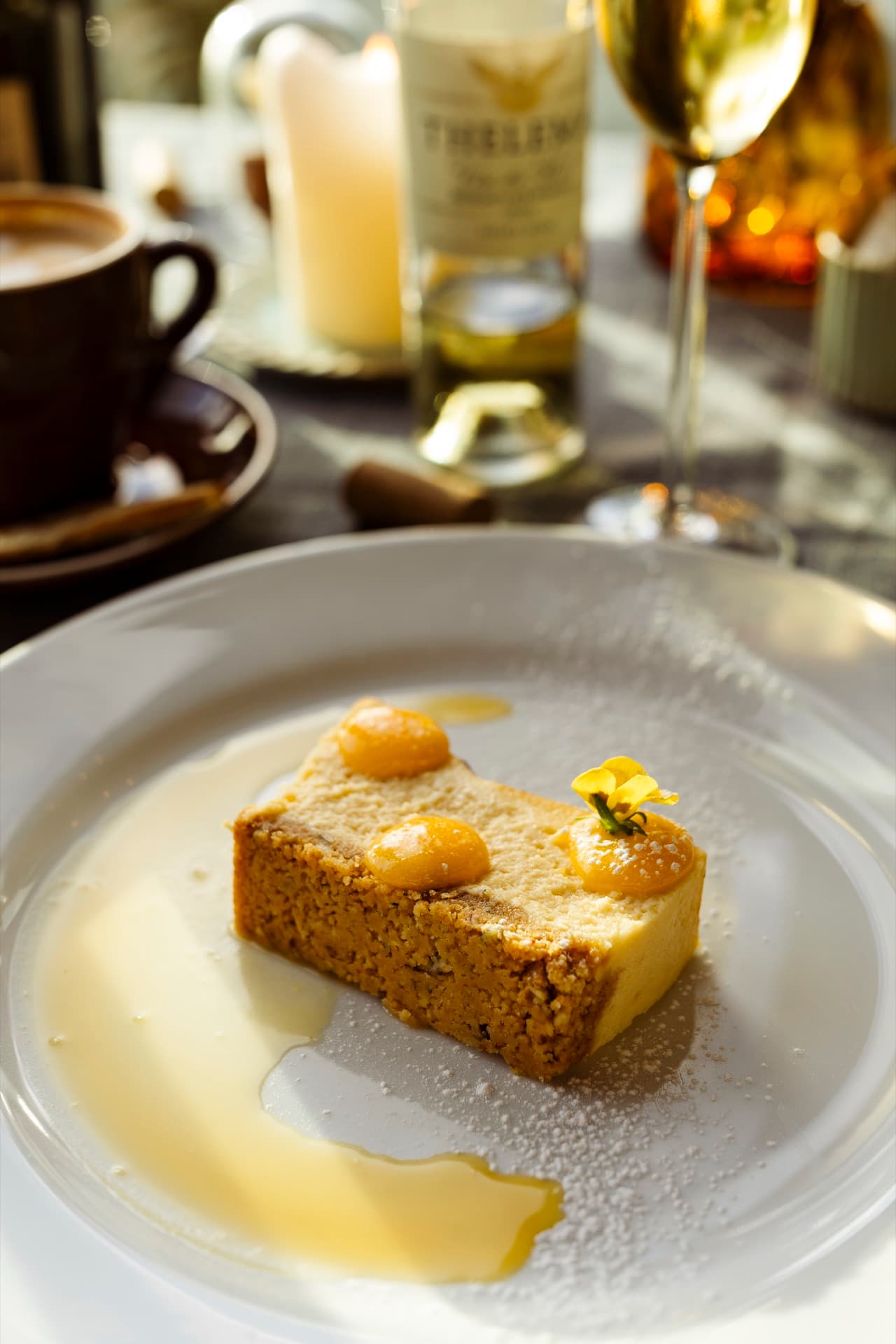 Burnt fynbos honey baked cheesecake with citrus curd, paired with Thelema Vin de Hel